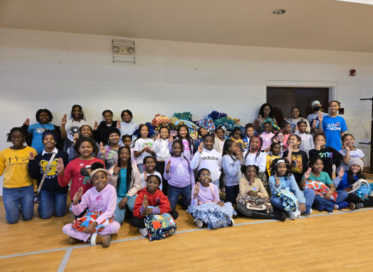Girls scouts pose after service project